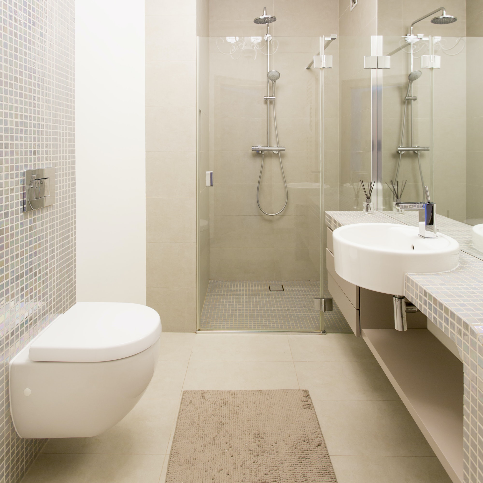 Light bathroom with glass shower cabin