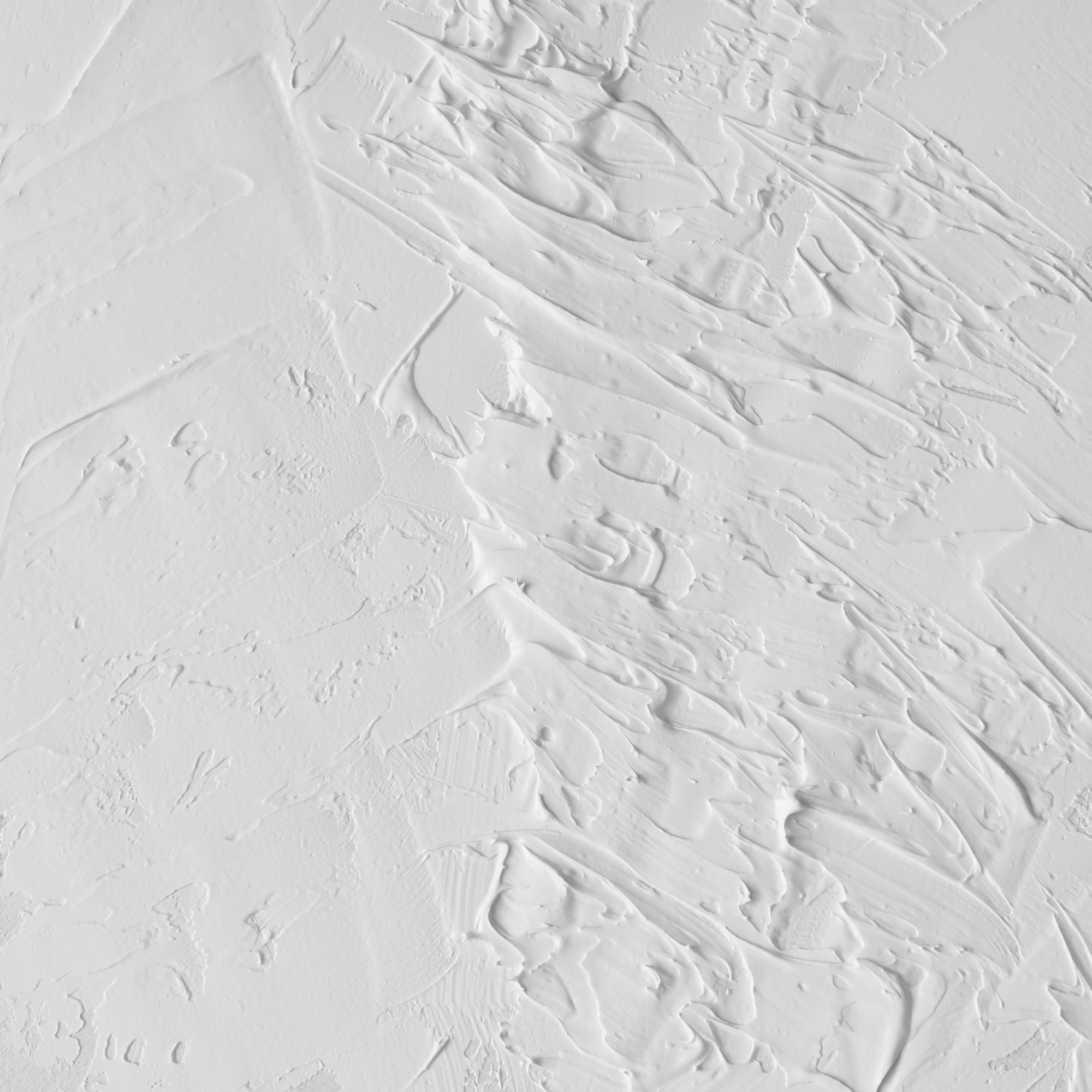 White abstract oil paint texture on canvas or wall.